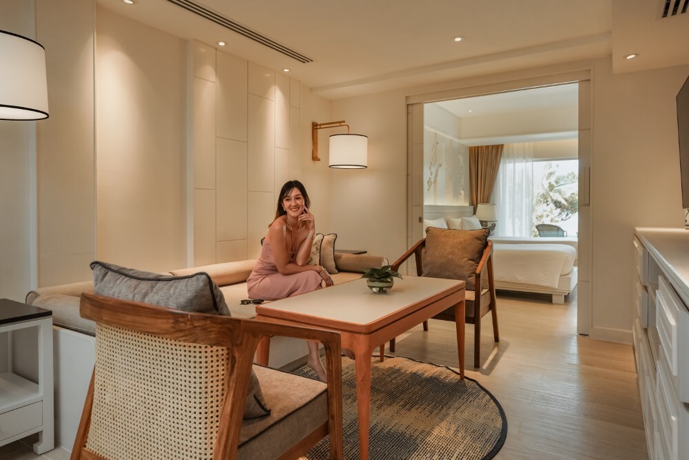 Suite living area with contemporary furnishings at Thavorn Palm Beach, a MICE hotel in Phuket