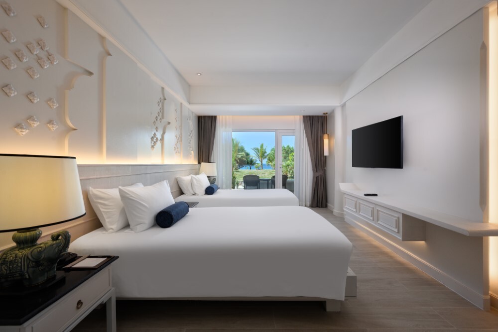 Luxury suite with stunning ocean views at Thavorn Palm Beach, a MICE hotel in Phuket