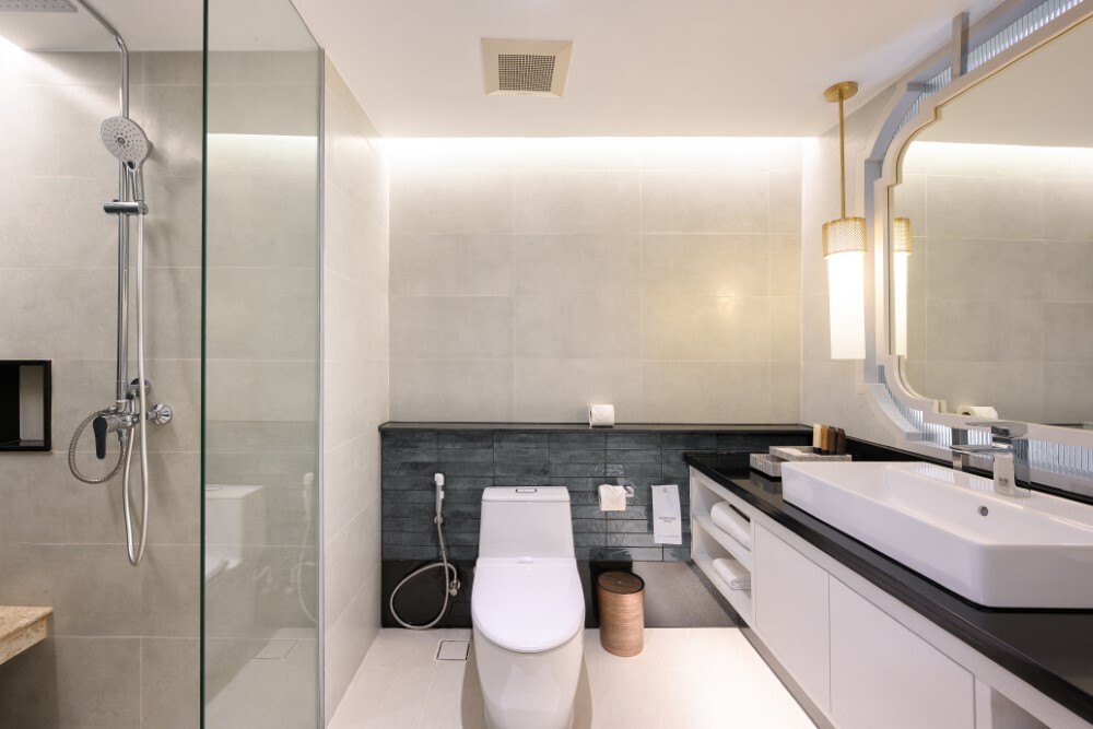 Bathroom inside a room at Thavorn Palm Beach, a MICE hotel in Phuket