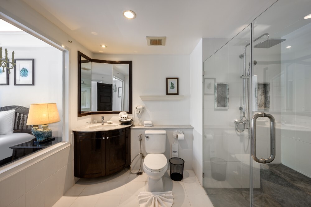 Bathroom in a deluxe terrace room at Thavorn Palm Beach, a MICE hotel in Phuket
