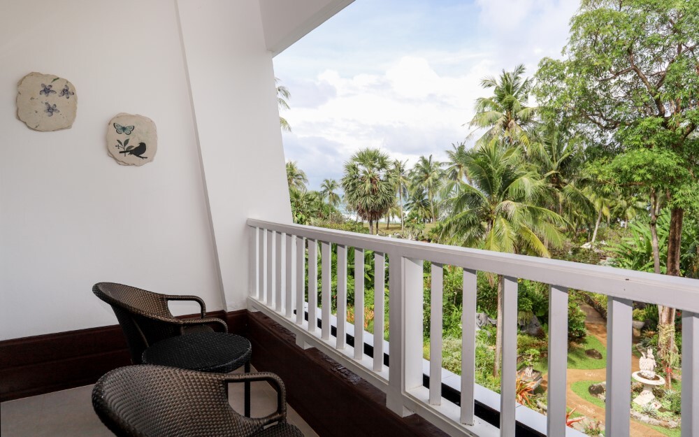 Deluxe terrace with outdoor lounging area at Thavorn Palm Beach, a MICE hotel in Phuket